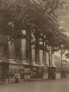 City street with columns of a building and hoardings, 1918-1920s. Creator: Eunice Harriett Garlick