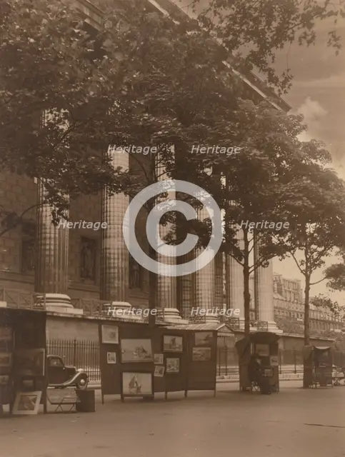 City street with columns of a building and hoardings, 1918-1920s. Creator: Eunice Harriett Garlick.