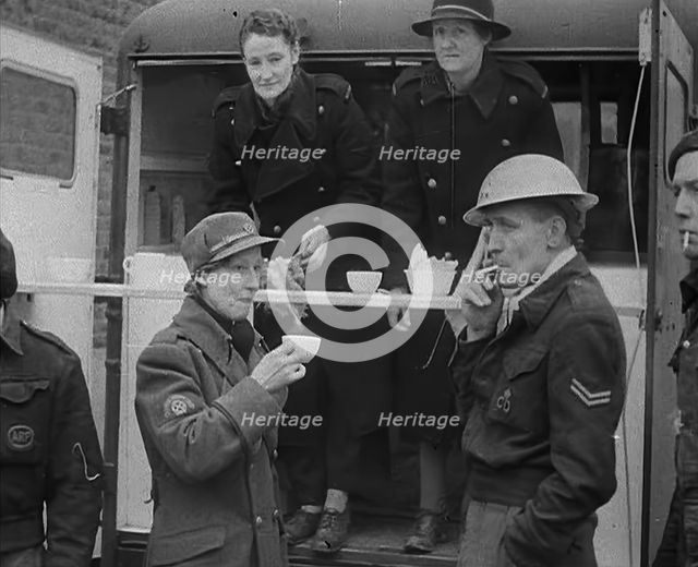 Civil Defence Corps Members Drinking Tea, 1940. Creator: British Pathe Ltd.