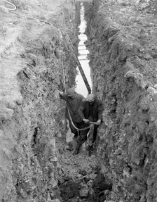 Civil engineers in a trench with a pneumatic drill, Oldcoats, Nottinghamshire, 1961. Creator: Michael Walters