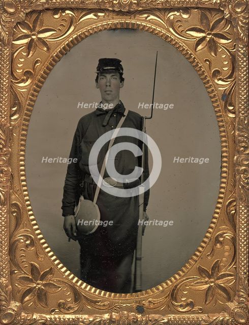 Civil War Union Soldier with Rifle and Canteen, in Studio, 1861-65. Creator: Unknown.