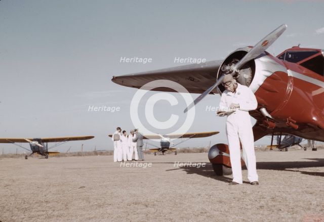 Civilian training school, students and instructors, Meacham Field, Fort Worth, Tex., 1942. Creator: Arthur Rothstein.