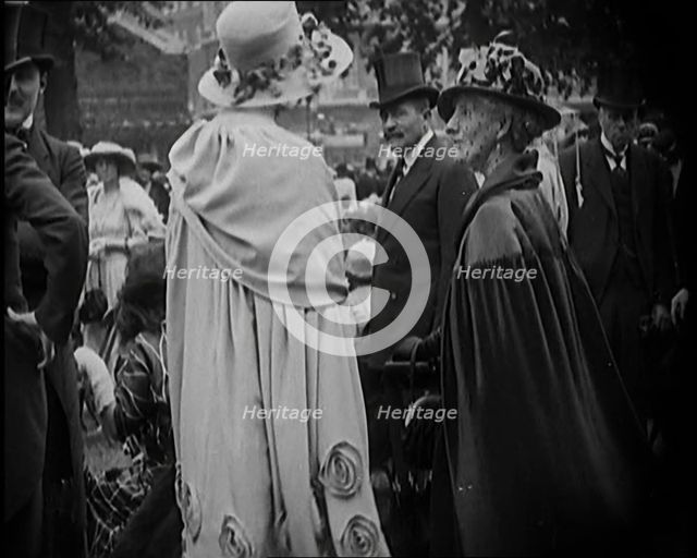 Civilians on the Street Wearing Evening Outfits, Hats and Top Hats, 1920. Creator: British Pathe Ltd.