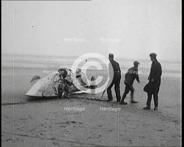 Civilians Attending the Wreckage of a Speed Car, 1927. Creator: British Pathe Ltd.