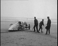Civilians Attending the Wreckage of a Speed Car, 1927. Creator: British Pathe Ltd