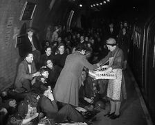 Civilians are Served Refreshments While Sheltering from Bombs in the London Underground, 1940. Creator: British Pathe Ltd