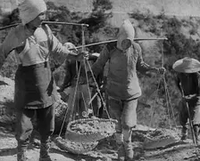 Civilians Carrying Supplies Along the Ledo or Burma Road, 1943. Creator: British Pathe Ltd