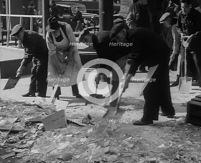 Civilians Clearing up Bomb Damage, 1940. Creator: British Pathe Ltd.