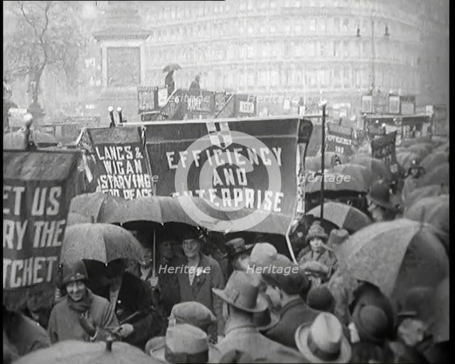 Civilians Demonstrating in London Against Continuous Strikes in the Rain. Signs Read..., 1926. Creator: British Pathe Ltd.