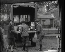 Civilians Dismantling an Emergency Food Distribution Centre and Loading Products Into a..., 1926. Creator: British Pathe Ltd