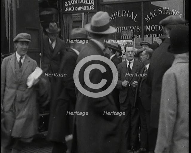 Civilians Disembarking from a Bus On the Streets of London, 1920s. Creator: British Pathe Ltd.