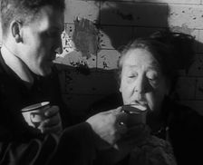 Civilians Drinking Hot Drinks While Sheltering from Bombs in the London Underground, 1940. Creator: British Pathe Ltd