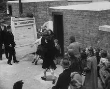Civilians Entering an Air Raid Shelter to Escape German Shelling, 1940. Creator: British Pathe Ltd