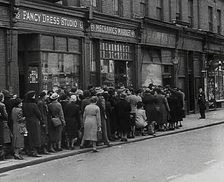 Civilians Queueing Outside a Food Shop, 1942. Creator: British Pathe Ltd