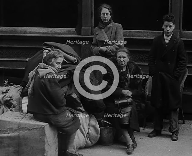 Civilians Surrounded by Bombed Out Buildings, 1940. Creator: British Pathe Ltd.