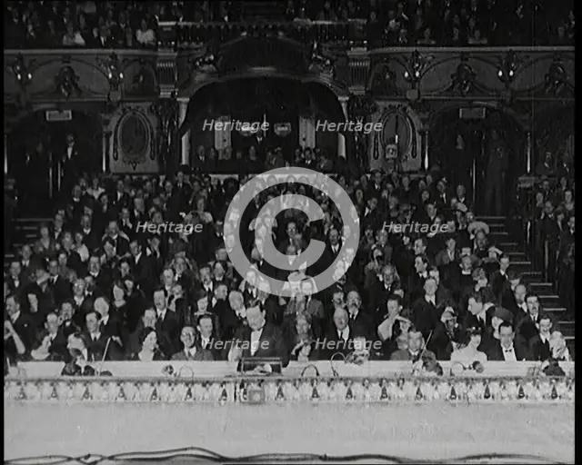 Civilians Seated Waiting For a Play To Begin As the Curtains Open, 1920s. Creator: British Pathe Ltd.