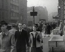 Civilians Walking Down a Street, 1942. Creator: British Pathe Ltd