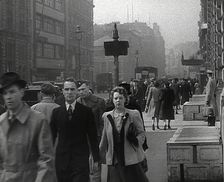 Civilians Walking Down a Street, 1942. Creator: British Pathe Ltd