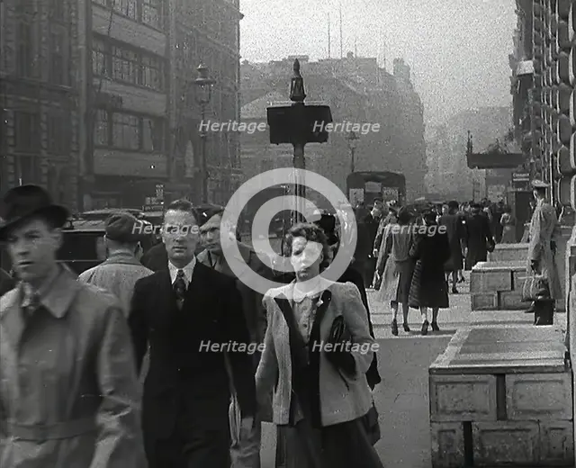 Civilians Walking Down a Street, 1942. Creator: British Pathe Ltd.
