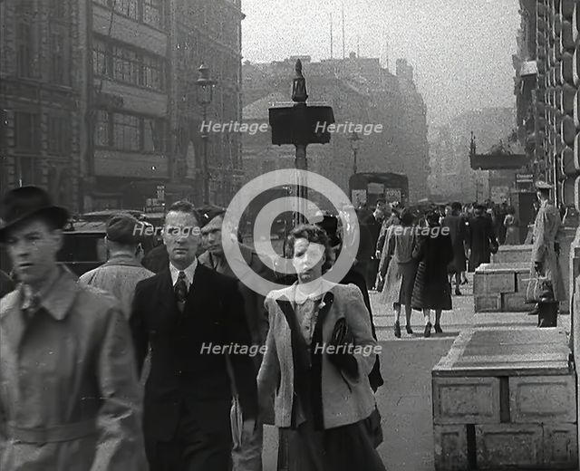 Civilians Walking Down a Street, 1942. Creator: British Pathe Ltd.