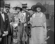 Civilians Wearing Smart Outfits and Hats Posing for the Camera During a Horse Race, 1920. Creator: British Pathe Ltd