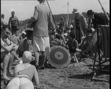 Civilians Wearing Swimsuits Leasuring on a Beach, 1920. Creator: British Pathe Ltd