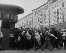 Civilians with newspapers in the Streets of Moscow, 1941. Creator: British Pathe Ltd