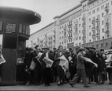 Civilians with newspapers in the Streets of Moscow, 1941. Creator: British Pathe Ltd