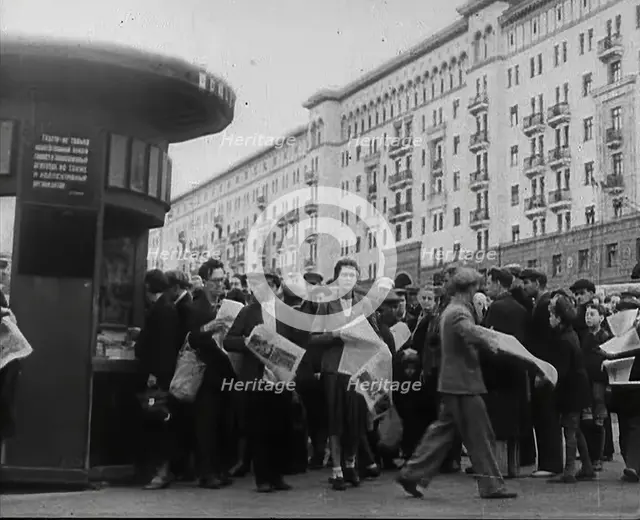 Civilians with newspapers in the Streets of Moscow, 1941.  Creator: British Pathe Ltd.
