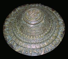 Circular plaque from Nepal with dancing figure, probably Chamunda