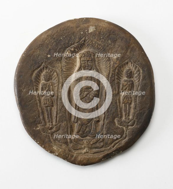 Circular plaque with Buddhist trinity on obverse..., Period of Division, Dated 500 CE. Creator: Unknown.