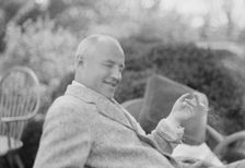 Clucas, E.W., seated outdoors, 1931 June 14. Creator: Arnold Genthe