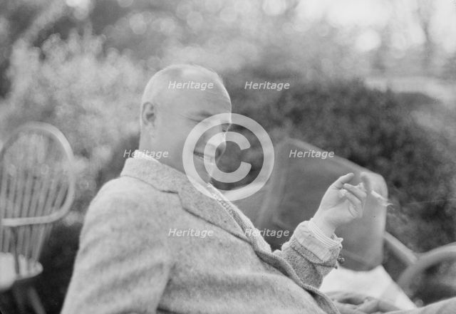 Clucas, E.W., seated outdoors, 1931 June 14. Creator: Arnold Genthe.
