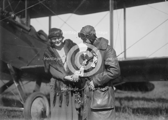 Claire Ogden, giving watch to Lieutenant W.C.F. Brown, between c1915 and c1920. Creator: Bain News Service.