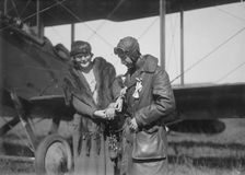 Claire Ogden, giving watch to Lieutenant W.C.F. Brown, between c1915 and c1920. Creator: Bain News Service