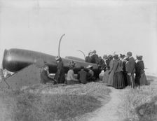Class from Hampton Institute, Hampton, Va., looking at cannon at Fort Monroe, 1899 or 1900. Creator: Frances Benjamin Johnston