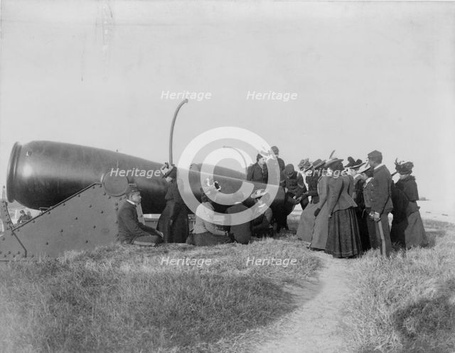 Class from Hampton Institute, Hampton, Va., looking at cannon at Fort Monroe, 1899 or 1900. Creator: Frances Benjamin Johnston.