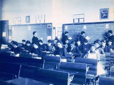 Classroom at the Indian Industrial School, Carlisle, Pennsylvania, between 1901 and 1903. Creator: Frances Benjamin Johnston