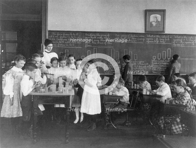 Classroom scene in Washington, D.C. elementary school - children working with blocks..., (1899?). Creator: Frances Benjamin Johnston.