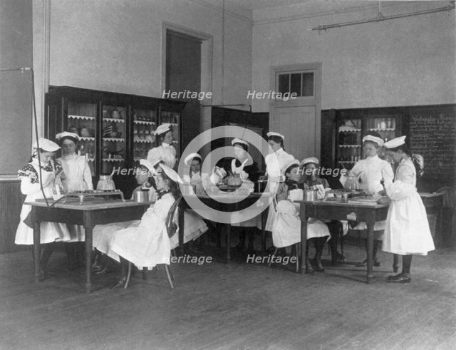 Classroom scene in Washington, D.C. elementary school - cooking class, (1899?). Creator: Frances Benjamin Johnston.