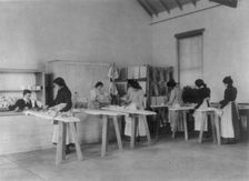 Classroom scenes at Carlisle, Pa., Indian School. Ironing; women students, 1901. Creator: Frances Benjamin Johnston
