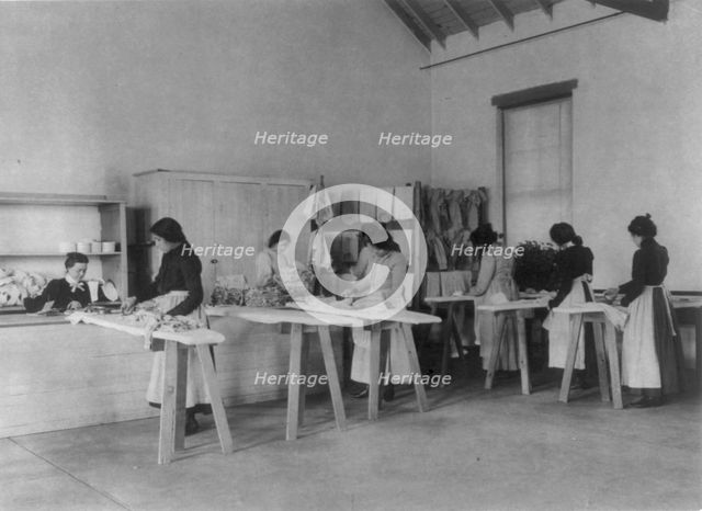 Classroom scenes at Carlisle, Pa., Indian School. Ironing; women students, 1901. Creator: Frances Benjamin Johnston.