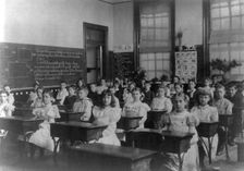 Classroom scenes in Washington, D.C. public schools: general classroom scene, 1st Division, (1899?). Creator: Frances Benjamin Johnston