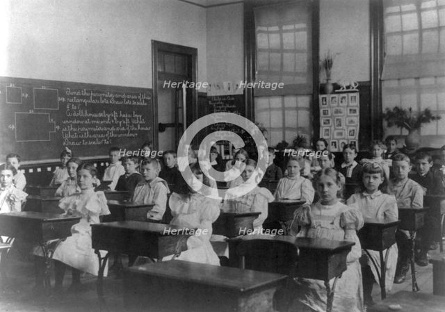 Classroom scenes in Washington, D.C. public schools: general classroom scene, 1st Division, (1899?). Creator: Frances Benjamin Johnston.