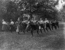 Classroom scenes in Washington, D.C. public schools - outdoor exercise with rods..., (1899?). Creator: Frances Benjamin Johnston