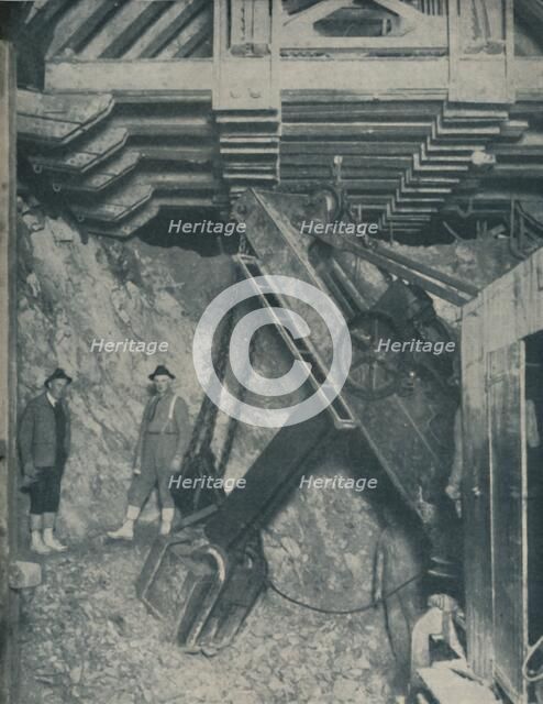 'Clawing Out the Heart of a Mountain for a Colorado City Tunnel', c1935. Artist: Unknown.
