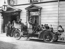 Claude Johnson behind the wheel of a 1905 Rolls-Royce 20hp. Creator: Unknown