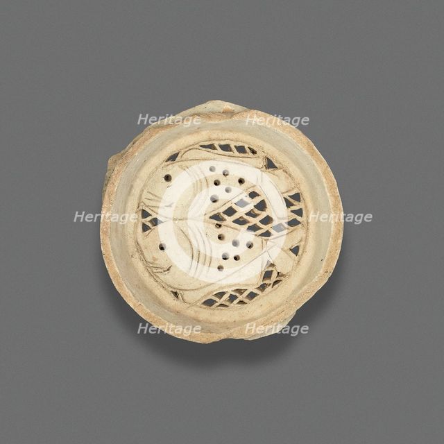Clay filter with design of fish, Fatimid dynasty (969-1171), 11th-12th century. Creator: Unknown.