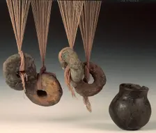 Clay loomweights and pot. Creator: Unknown
