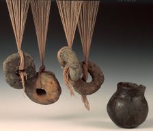 Clay loomweights and pot. Creator: Unknown